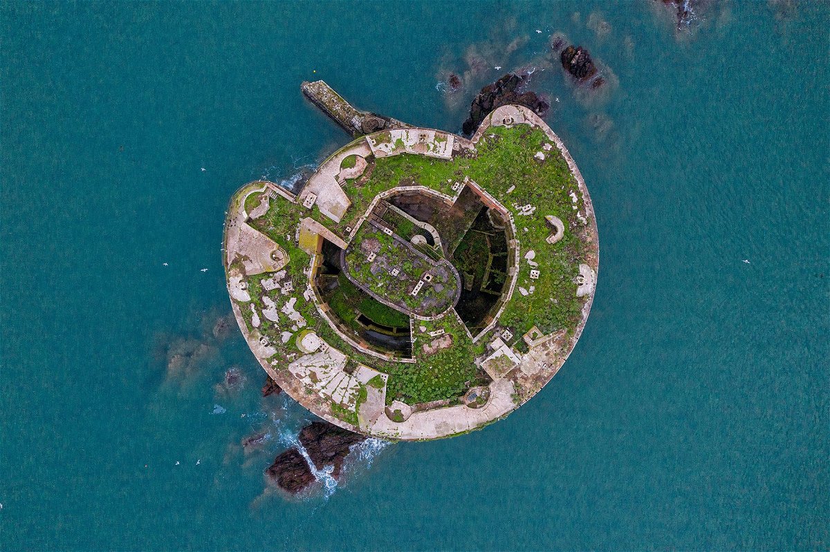 Once a military site, Stack Rock Fort, in Wales, is now derelict and being reclaimed by plant life and sea birds.