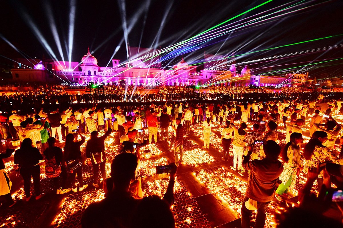 People in Ayodhya, India, watch a laser show on the eve of Diwali on November 3, 2021.