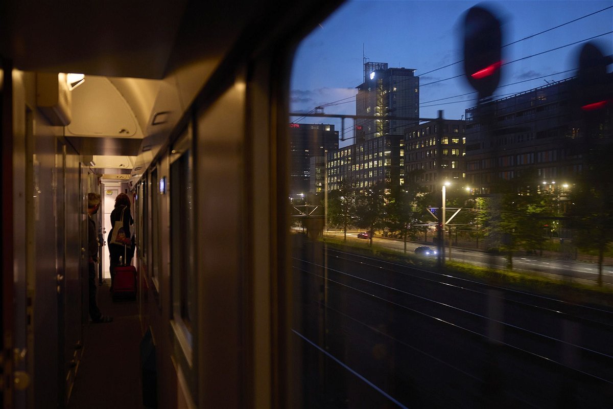 A passenger heads to her cabin on board the Good Night Train service, operated by European Sleeper, as it departs Amsterdam. The success or failure of a new, no-frills night train service from Brussels to Berlin could set a precedent for future startup routes.