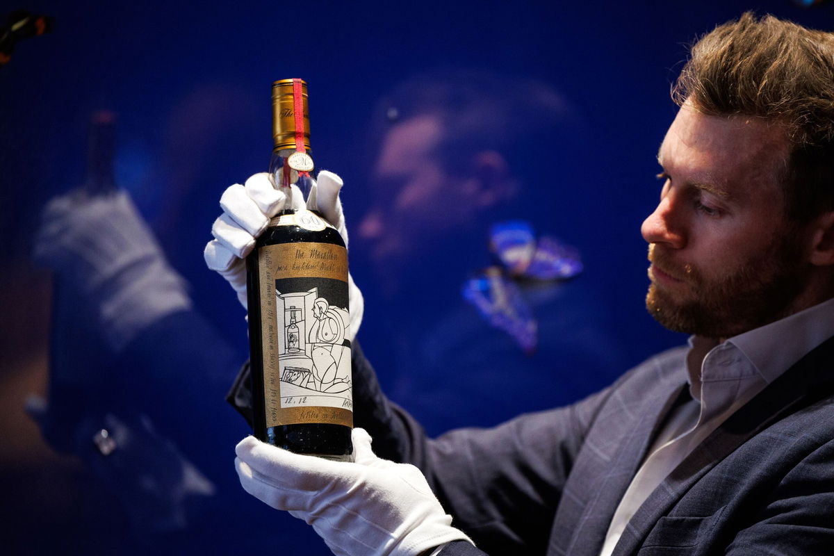 Jonny Fowle, Sotheby's global head of whisky, unveils a bottle of The Macallan 1926, the world's most expensive whisky on October 19, 2023 in London, England.