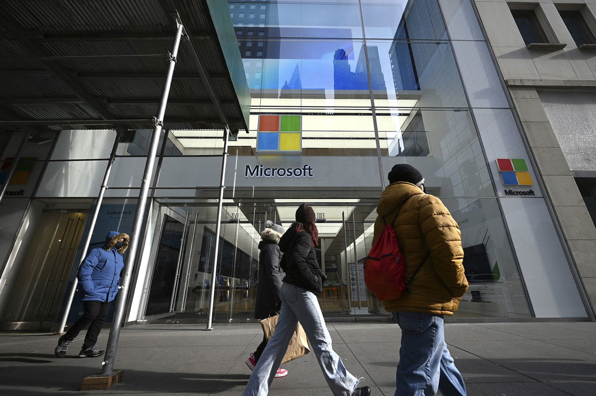 <i>Anthony Behar/Sipa/AP</i><br/>People walk past Microsoft Corp. Fifth Avenue retail store in New York