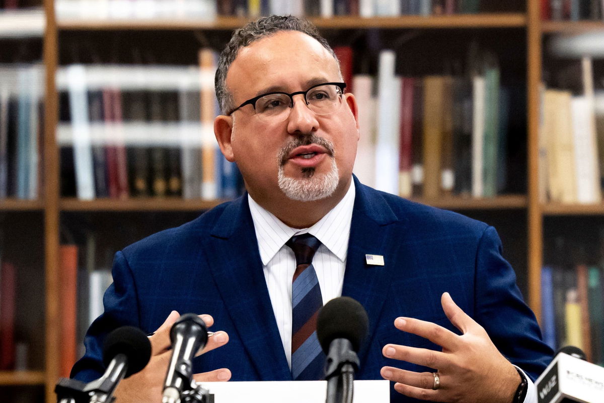 <i>Julia Nikhinson/AP</i><br/>Education Secretary Miguel Cardona speaks with students during a visit to Towson University to discuss antisemitism on college campuses on November 2.