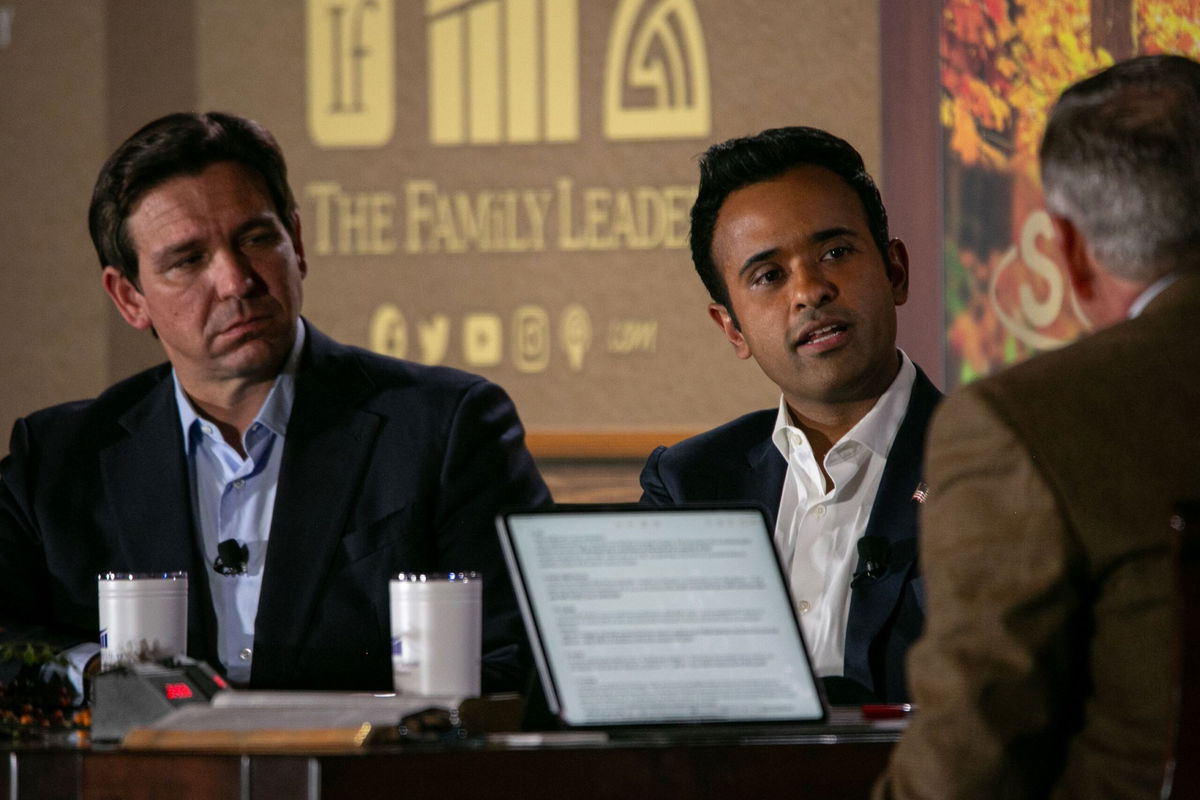 <i>Jim Vondruska/Getty Images</i><br/>Republican presidential candidate Florida Governor Ron DeSantis listens as Republican presidential candidate Vivek Ramaswamy speaks at the Thanksgiving Family Forum at the downtown Marriott on November 17 in Des Moines