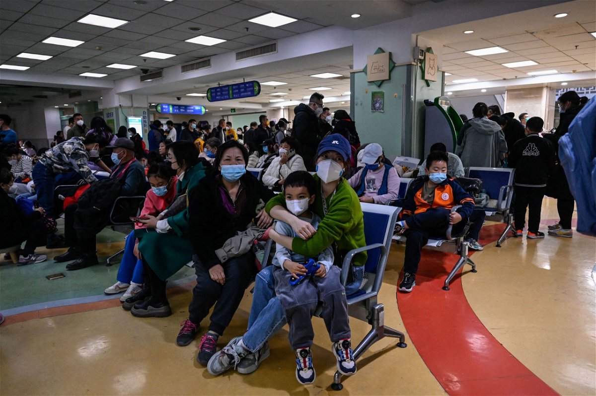Families wait for medical care at a children's hospital in Beijing on November 23.