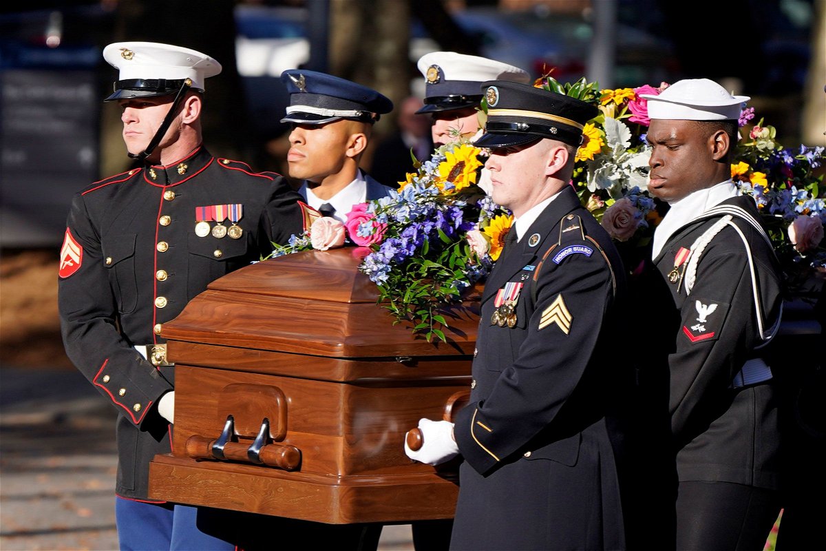 A military team carries the casket of former first lady Rosalynn Carter upon arrival at the Jimmy Carter Presidential Library and Museum, Monday, November 27, in Atlanta.