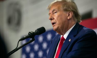 Former President Donald Trump speaks to a crowd of supporters at the Fort Dodge Senior High School on November 18 in Fort Dodge