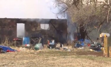 A person was taken to the hospital after flames engulfed a home in Guthrie