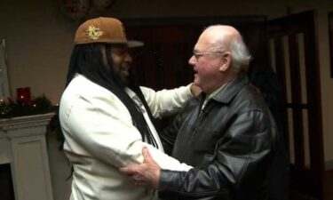 Umar Fox embraces retired Boston Firefighter Joseph Gilmore as they meet for the first time on Dec. 27