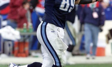 Frank Wycheck of the Tennessee Titans celebrates after Kevin Dyson scored on a kickoff return during an AFC wild card game on January 8