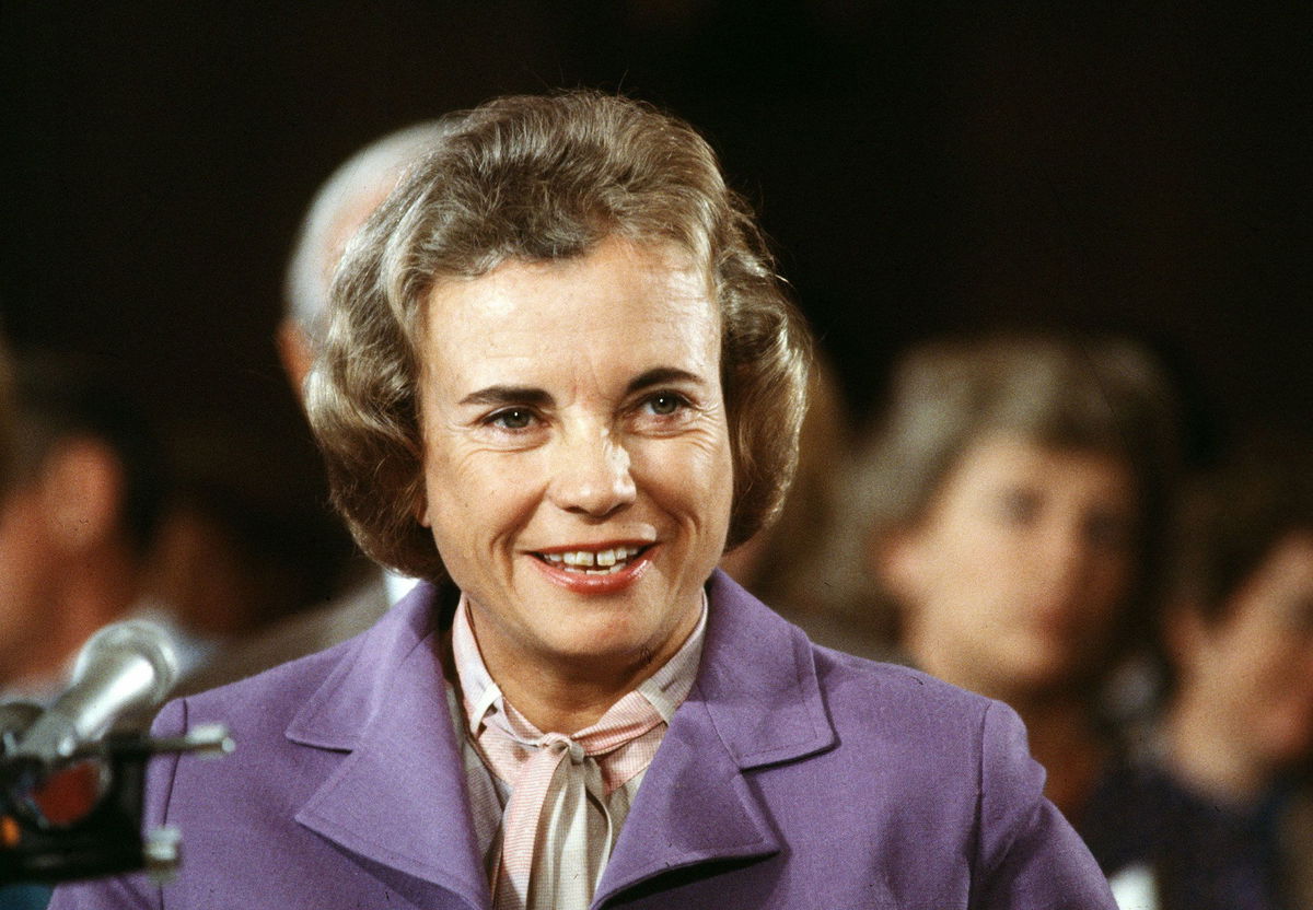 <i>Ron Edmonds/AP</i><br/>Supreme Court nominee Sandra Day O'Connor smiles during her confirmation hearing before the Senate Judiciary Committee