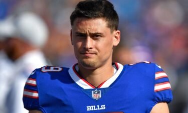 Then-Buffalo Bills punter Matt Araiza walks on the sideline during the first half of a preseason NFL football game against the Indianapolis Colts in August 2022. Araiza will be dropped from a civil lawsuit accusing him and others of gang rape.