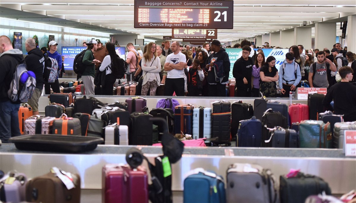 <i>Paul Hennessy/Anadolu Agency/Getty Images</i><br/>Unclaimed luggage piles up at baggage carousels at Orlando International Airport in December 2022. US airlines know there will be even more passengers flying this year but are aiming to avoid the massive Christmas headaches of 2022.