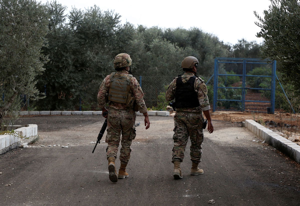 <i>Mohamed Azakir/Reuters</i><br/>Members of the Lebanese army walk in the village of Dhayra