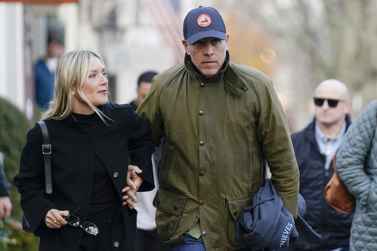 <i>Stephanie Scarbrough/AP</i><br/>Hunter Biden walks with wife Melissa Cohen as they visit shops with President Joe Biden and first lady Jill Biden in Nantucket