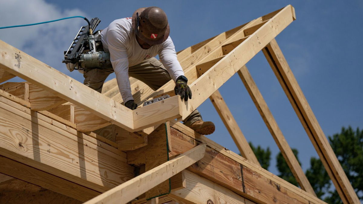 A worker builds a home in Lillington, North Carolina, on June 15.