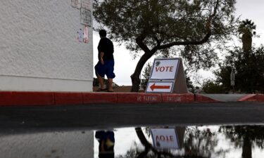 A voters arrives at a polling center on November 08