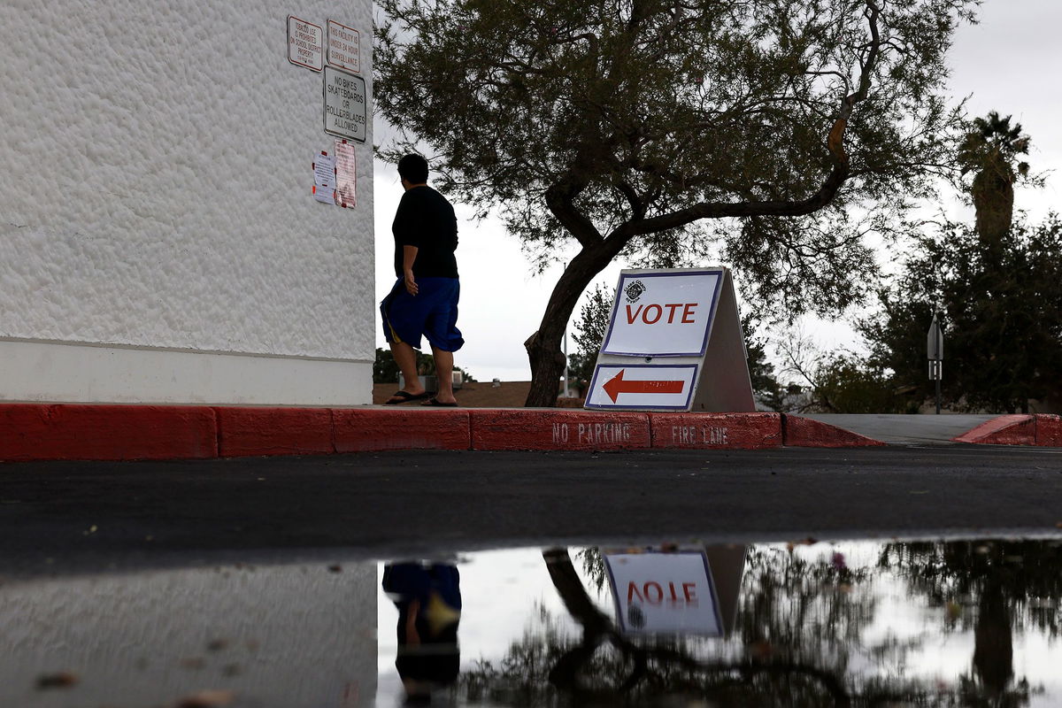 <i>Anna Moneymaker/Getty Images</i><br/>A voters arrives at a polling center on November 08