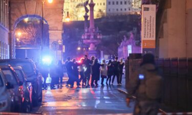 Students of Charles University are evacuated by police after a shooting on December 21