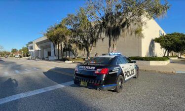 A law enforcement officer is seen at the Paddock Mall in Ocala