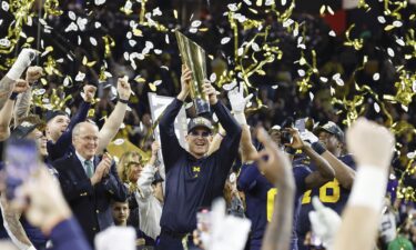 Harbaugh reacts in the first quarter against the Huskies.