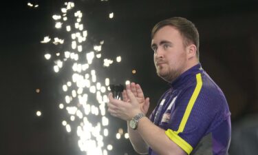 Fans celebrate at the PDC World Darts Championship in London.