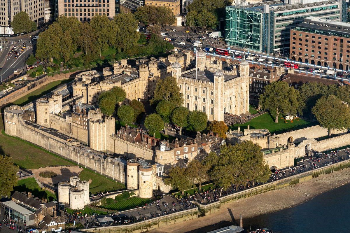 People gather to visit the Tower of London, on the north bank of the River Thames on October 24, in London, England. With an array of notable tourist attractions, London, the capital city of England, is one of the world's most visited cities.