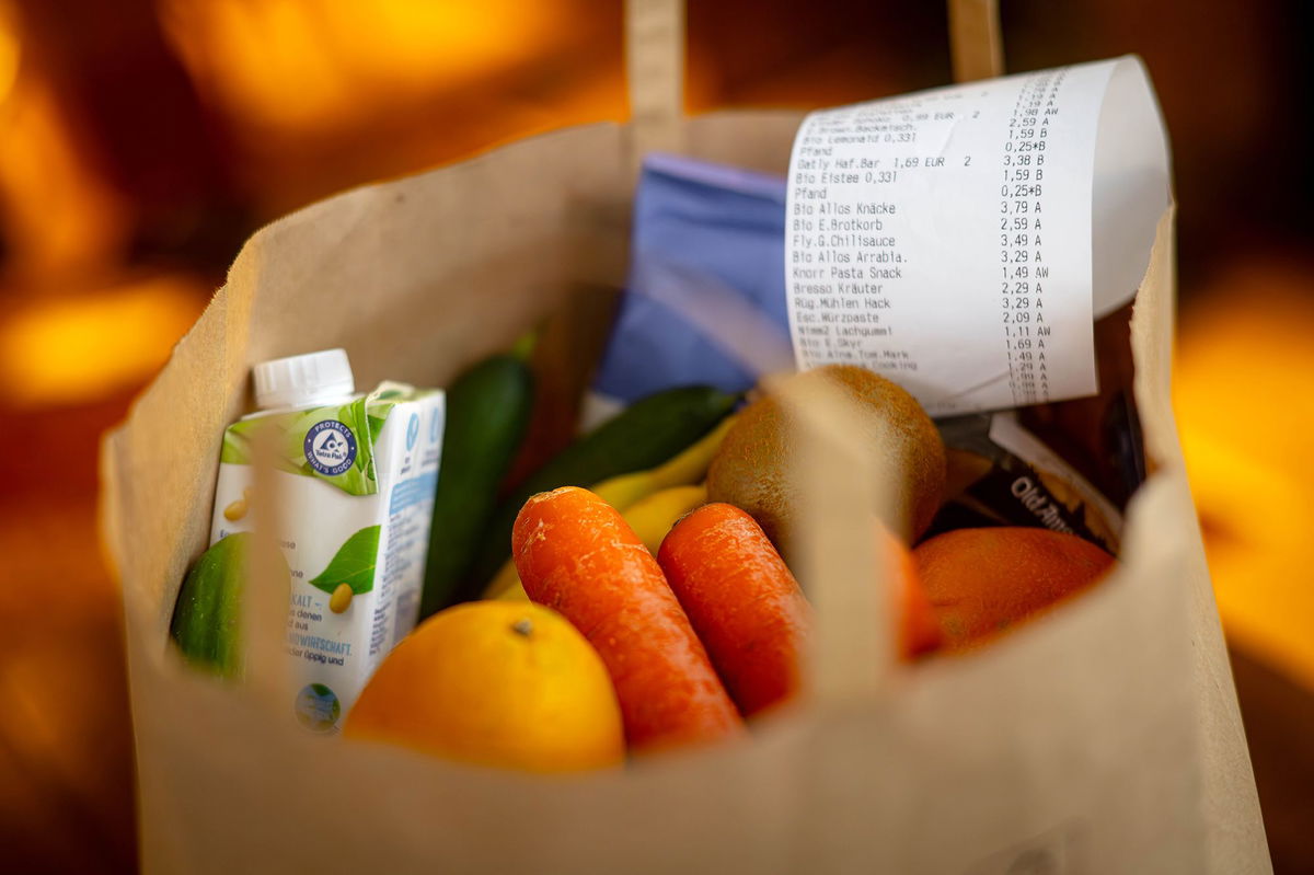 A receipt lies on top of the groceries in a shopping bag on November 27, 2023, in Bremen, Germany.