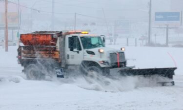 A snow plow gets to work in a powerful winter storm in Sioux City