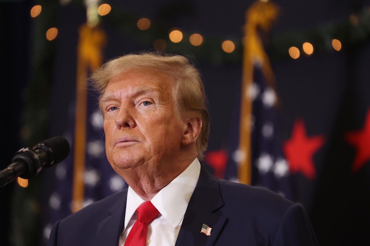 Former President Donald Trump looks on during a campaign event in December 2023 in Waterloo, Iowa. The Supreme Court has agreed to decide whether Trump can be barred from holding office.