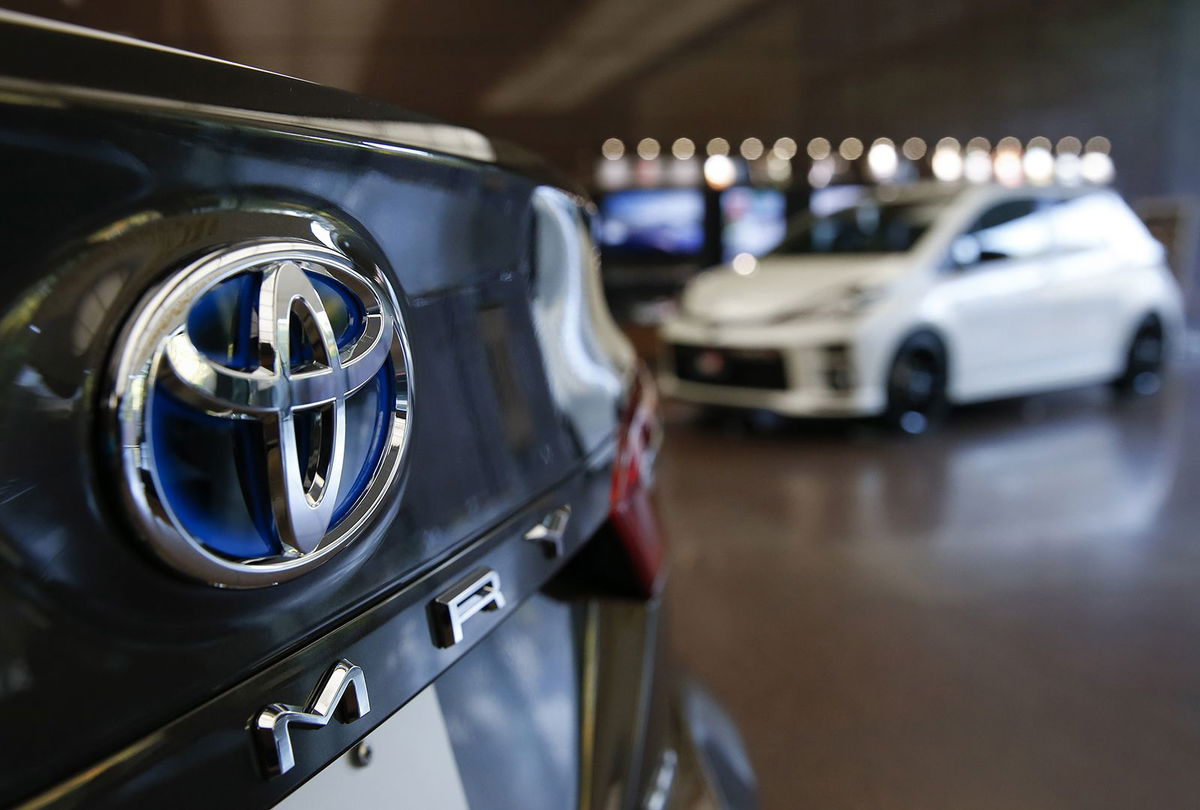 The Toyota Motor Corp. logo is seen on a Camry sedan displayed at the company's offices in Tokyo, Japan, on Tuesday, November 7, 2017.