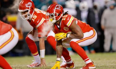 Kansas City Chiefs quarterback Patrick Mahomes (15) celebrates after throwing a touchdown pass during the first half of an NFL playoff game against the Miami Dolphins on January 13.