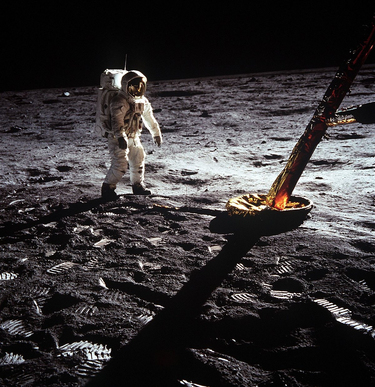 Astronaut Buzz Aldrin is pictured here walking on the surface of the moon near a leg of the lunar module during the Apollo 11 mission.