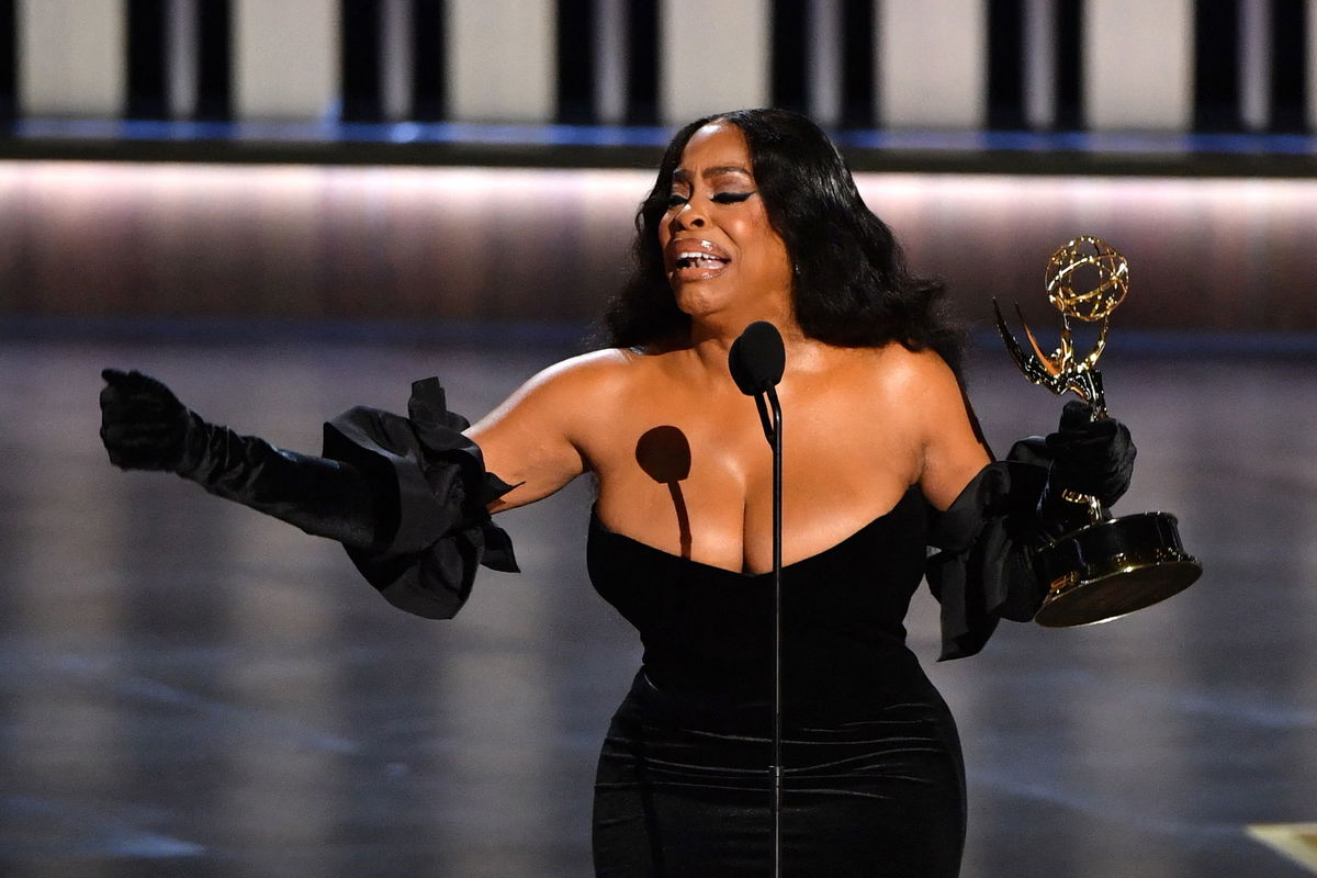 <i>Valerie Macon/AFP/Getty Images</i><br/>Niecy Nash-Betts speaks onstage during the 75th Emmy Awards on Monday.