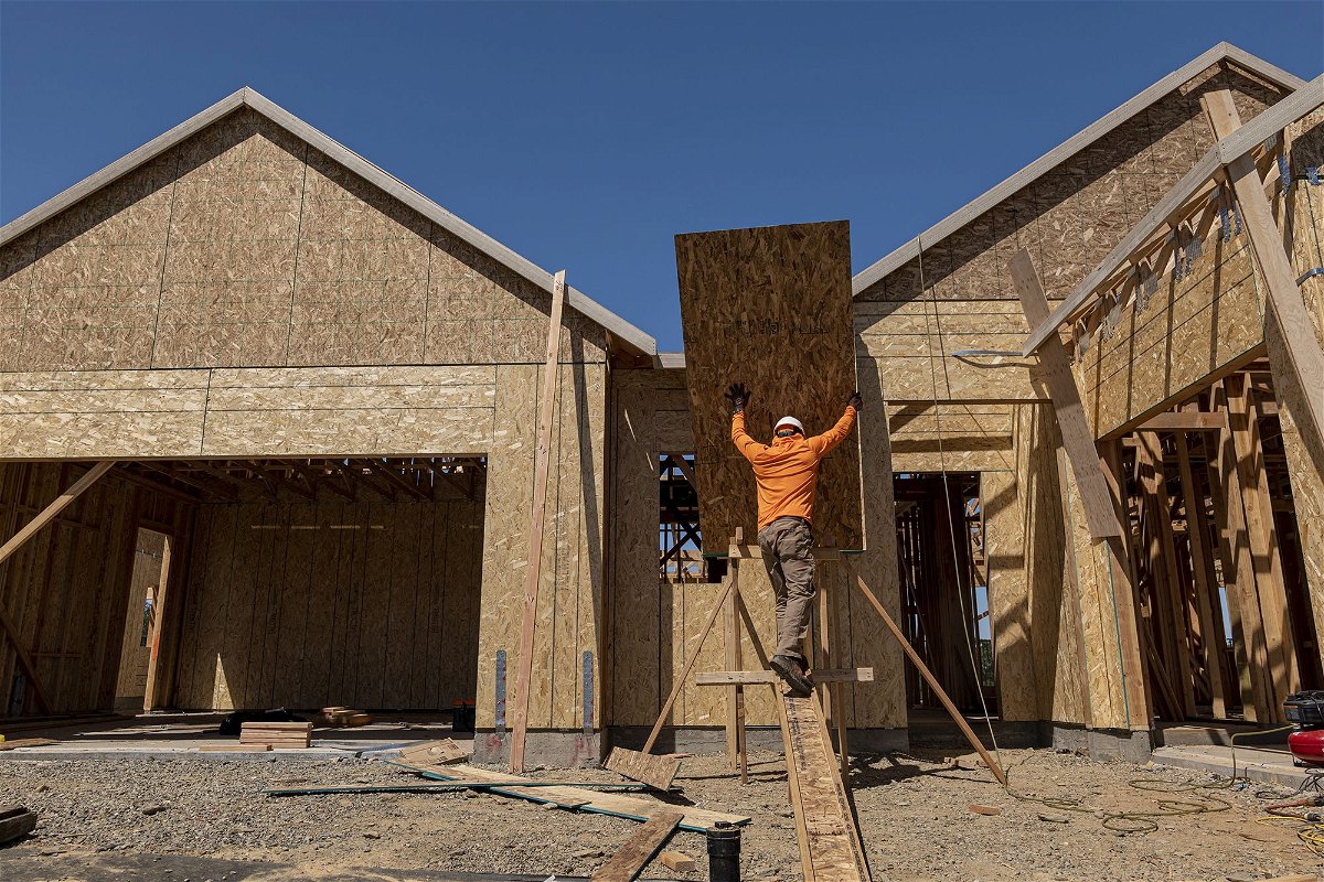 A contractor works on a house under construction at the Toll Brothers Regency at Folsom Ranch community in Folsom, California, on Thursday, May 18, 2023.