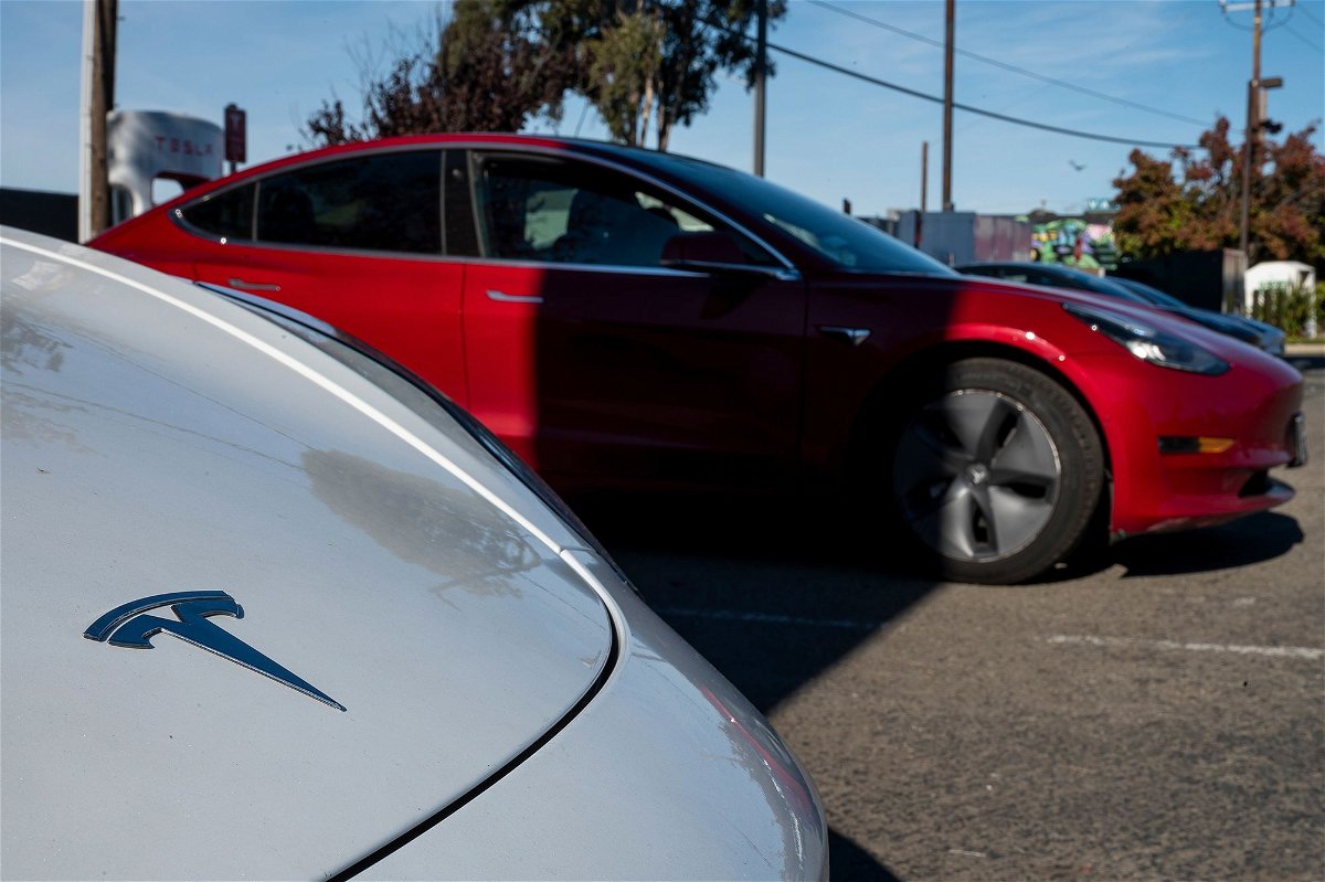 Tesla vehicles are charged at a Supercharger station in Richmond, California. Hertz recently announced it was selling 20,000 electric cars out of its fleet, and replacing them with gasoline vehicles. One reason the company gave was that drivers kept crashing the cars.