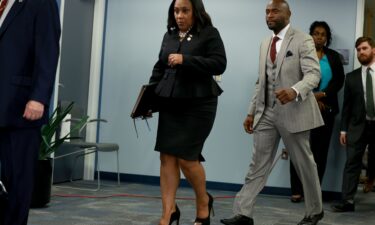 Fulton County District Attorney Fani Willis arrives to speak at a news conference at the Fulton County Government building on August 14