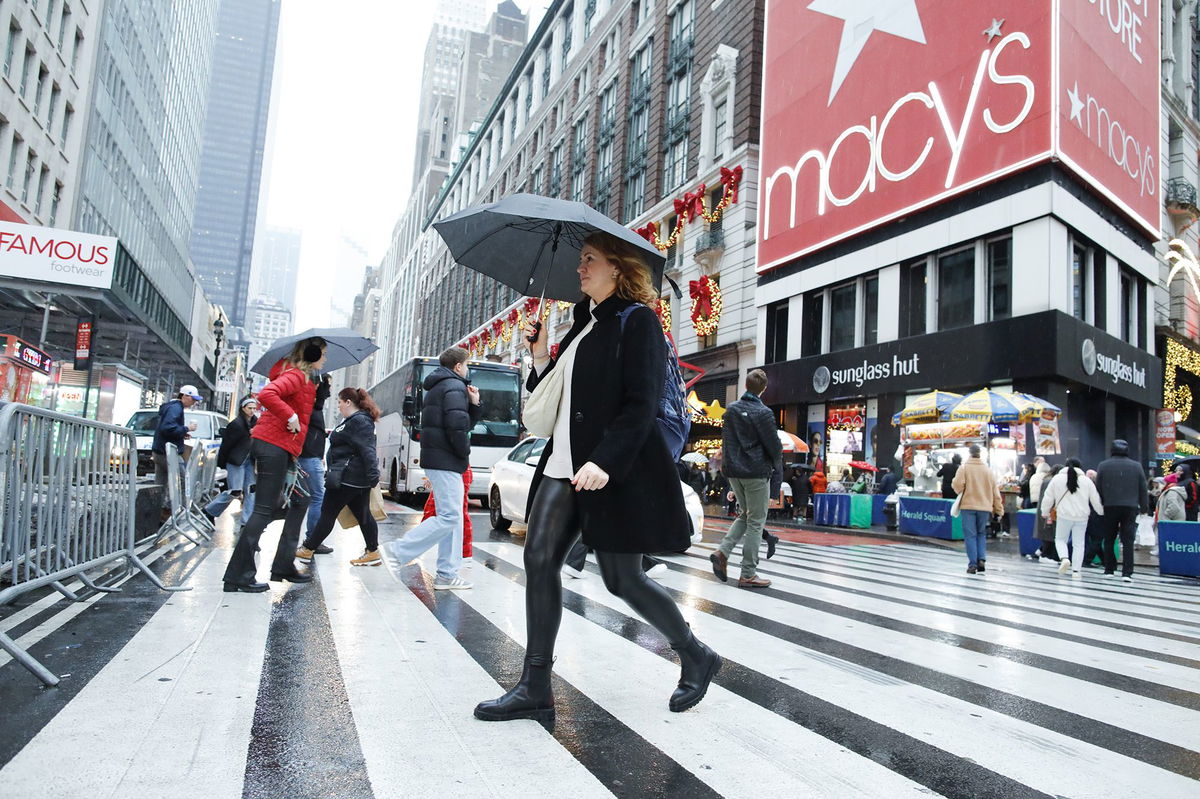 People cross the street outside Macy's Herald Square store in December 2023. Macy’s has rejected a $5.8 billion offer to take the 165-year-old retailer private.