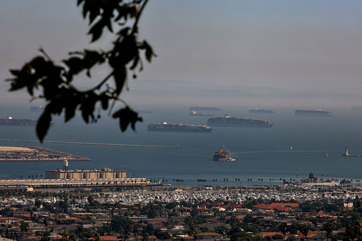 Cargo ships at the Port of Los Angeles on October 13, 2021 in San Pedro, California. The huge cargo ships that criss-cross the world’s oceans sometimes leave “tracks” in their wake — long, wispy clouds that trail through the sky, lasting for a handful of days at most before disappearing.