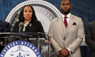 Fulton County District Attorney Fani Willis speaks at a press conference next to prosecutor Nathan Wade after a Grand Jury brought back indictments against former president Donald Trump and his allies in their attempt to overturn the state's 2020 election results