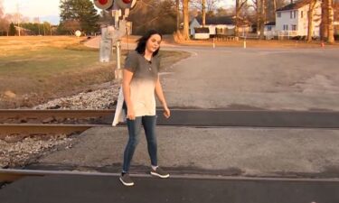 An 18-year-old girl is being called a hero after she jumped in to save a stranger struck on the railroad tracks last week.