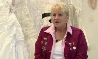 A Surry County woman is paying it forward and is gifting dozens of wedding dresses to brides on a budget