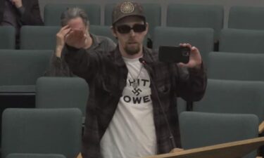 A man wearing a "white power" T-shirt and swastikas went on a hate-filled