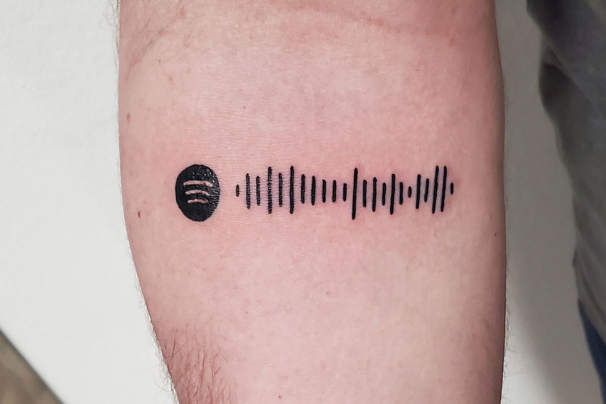 The above ink, on the forearm of tattooer John Lapides' first Spotify tattoo customer, leads to the Michael Bublé song 