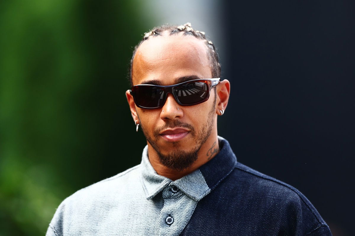 <i>Clive Rose/Getty Images</i><br/>Hamilton walks the grid ahead of last year's Japanese Grand Prix.