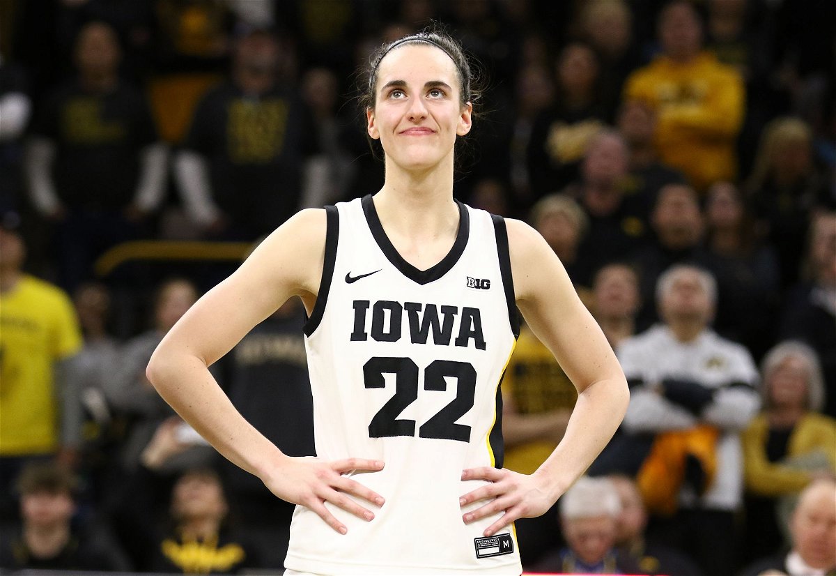 Caitlin Clark of the Iowa Hawkeyes listens as the crowd cheers after breaking the NCAA women's all-time scoring game last week.