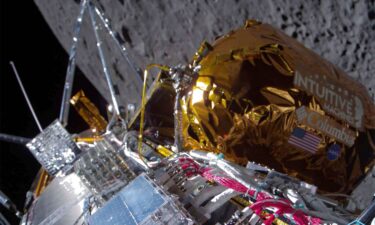 This image provided by Intuitive Machines shows its Odysseus lunar lander over the near side of the moon following lunar orbit insertion on February 21. Koons' "Moon Phases" is visible on the lander's exterior.