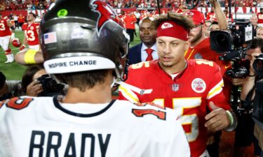 Mahomes celebrates after throwing a touchdown pass during the first half of the Chiefs' Wild Card playoff victory over the Miami Dolphins.