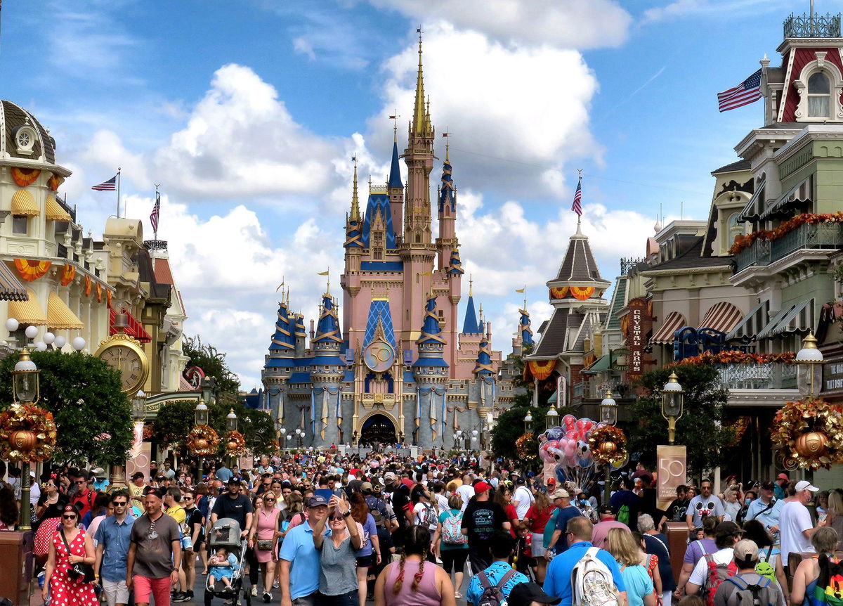 <i>Joe Burbank/Orlando Sentinel/Tribune News Service/Getty Images</i><br/>Crowds fill Main Street USA in front of Cinderella Castle at the Magic Kingdom in Lake Buena Vista