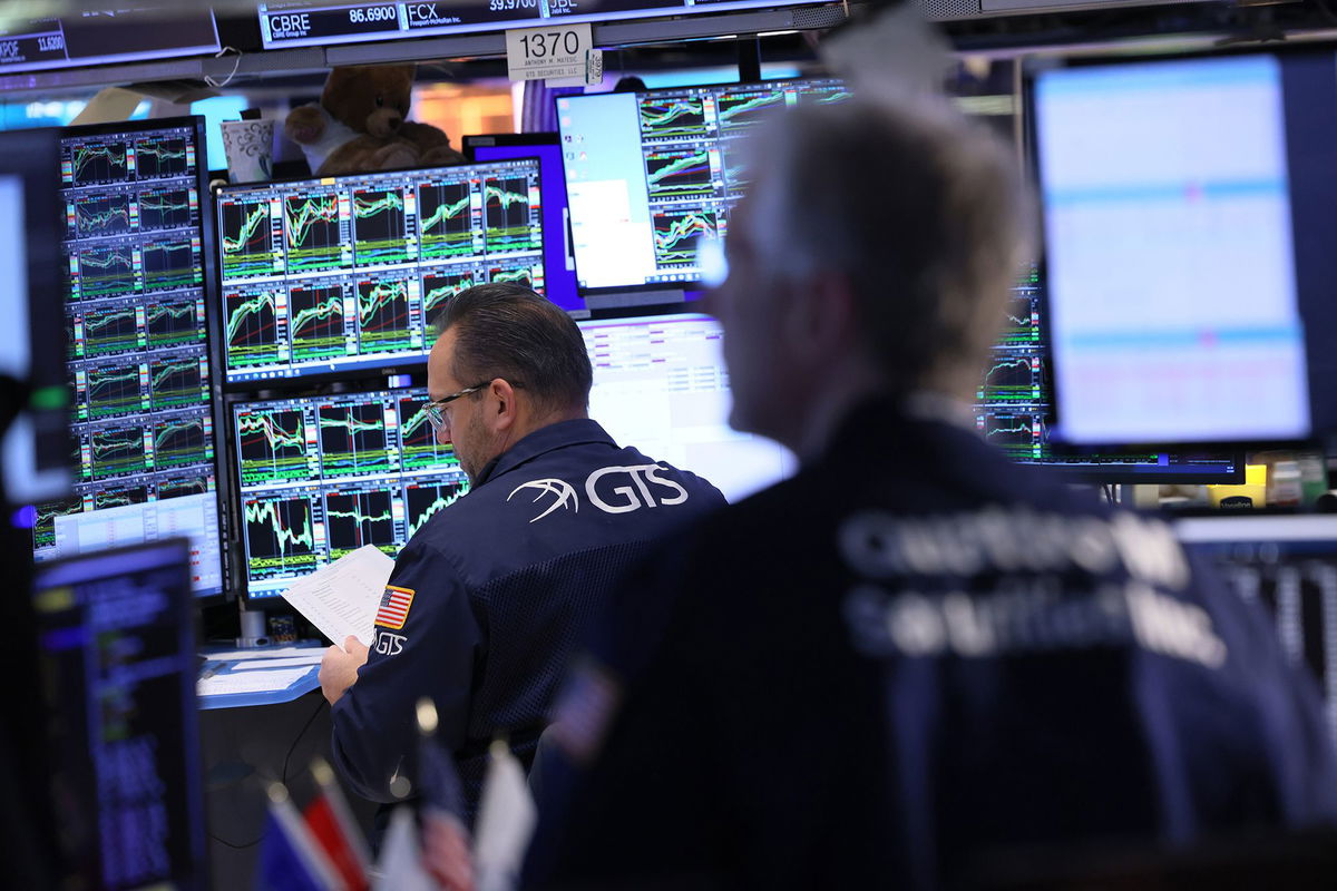 Traders work on the floor of the New York Stock Exchange.