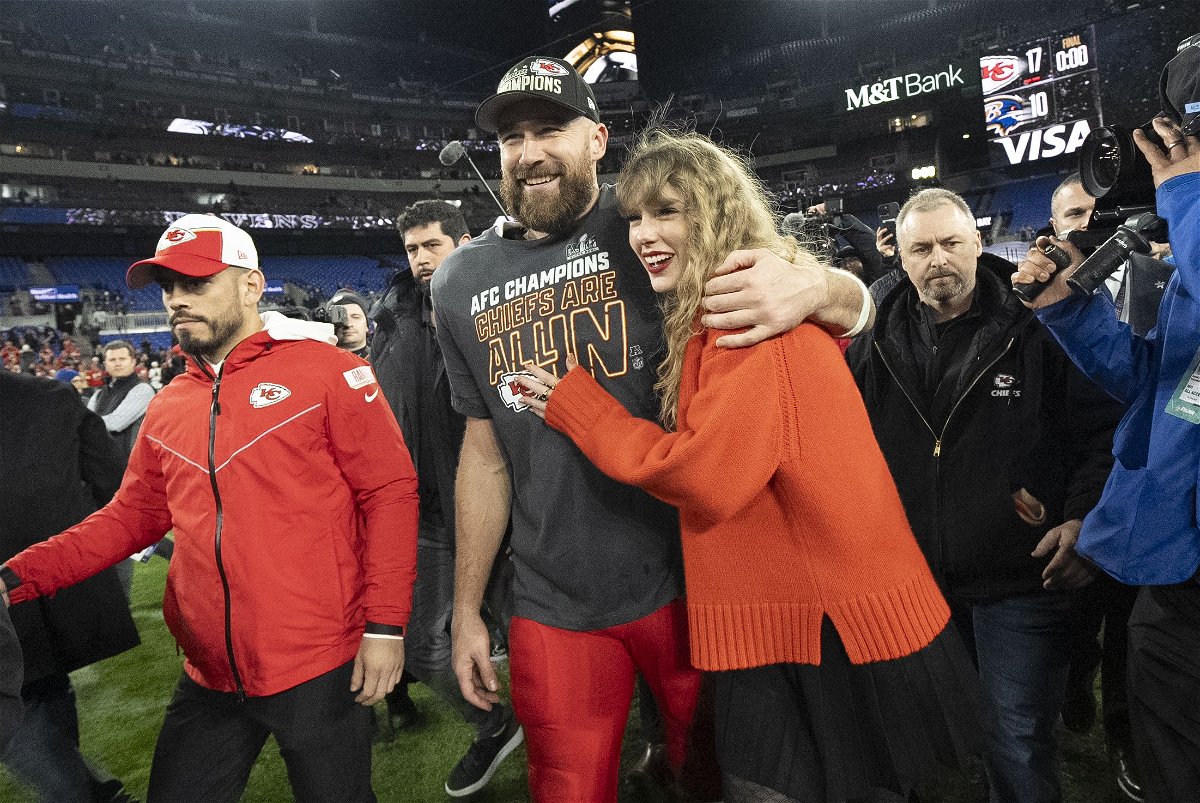 <i>Julio Cortez/AP</i><br/>Travis Kelce and Taylor Swift are both at the top of their respective industries. The Kansas City Chiefs tight end and pop superstar celebrate after his team defeated the Baltimore Ravens on January 28.